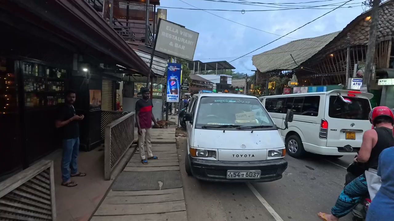Busy main street of Ella town at dusk, Sri Lanka