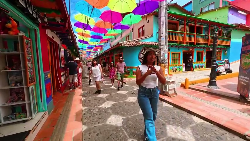 Umbrella street with colorful zocalos houses in Guatape