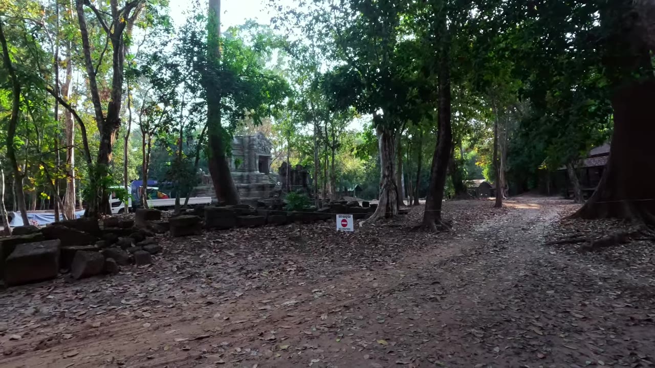 Traveler riding through the wider Angkor area on a scooter