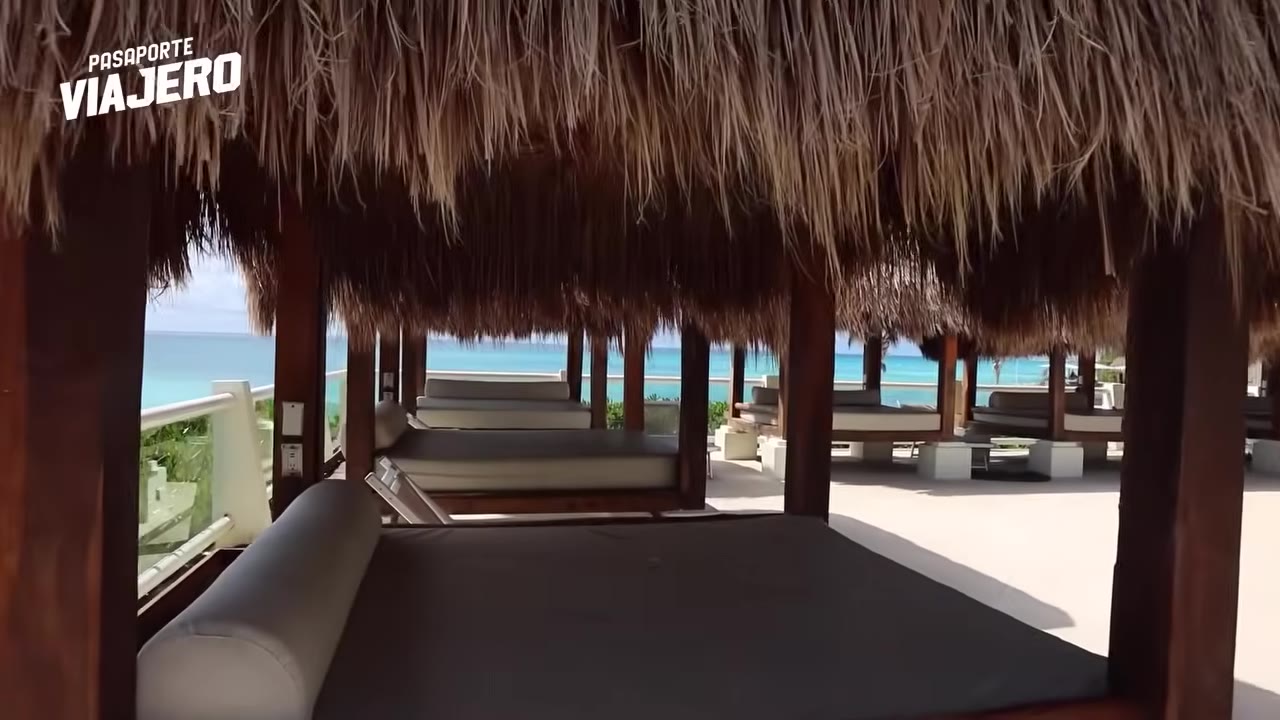 Cancun all-inclusive resort pool overlooking a white-sand beach