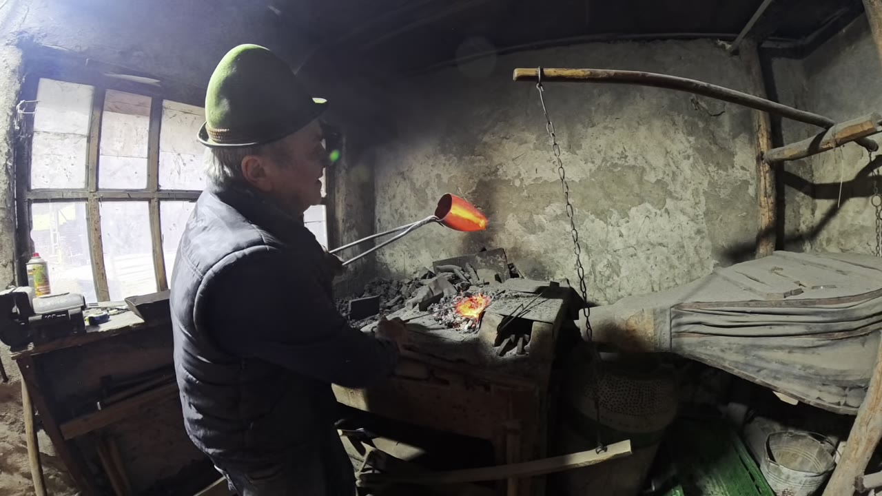 Finished Romanian shepherd bells displayed after being hand-shaped from sheet metal